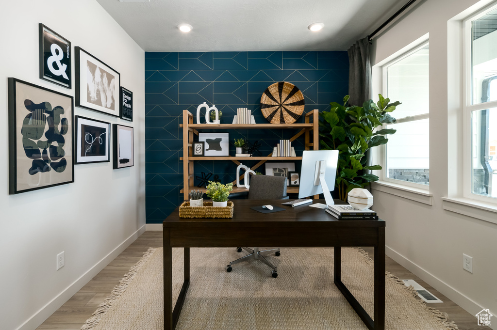 Office space featuring light hardwood / wood-style flooring