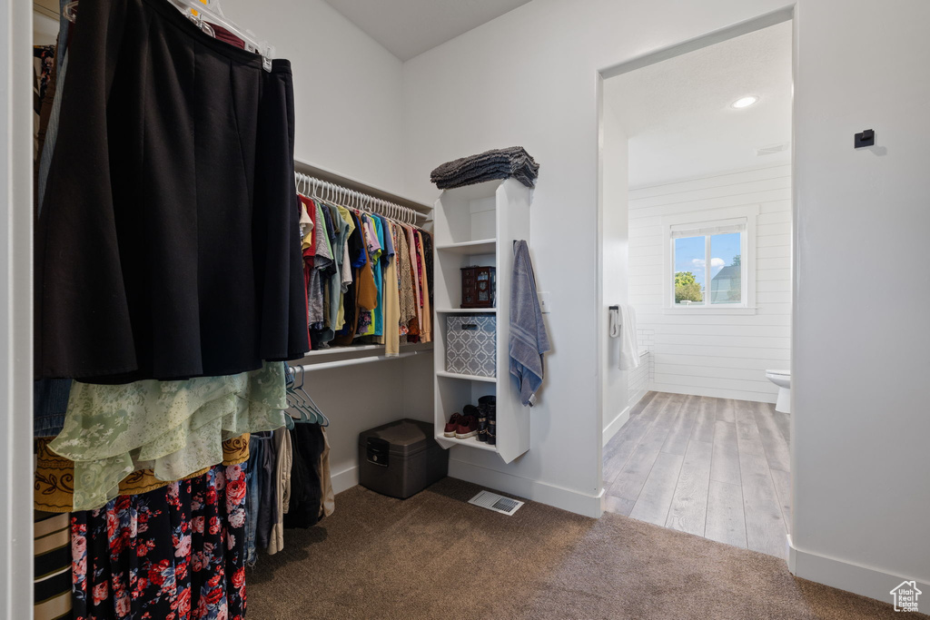 Walk in closet featuring hardwood / wood-style flooring