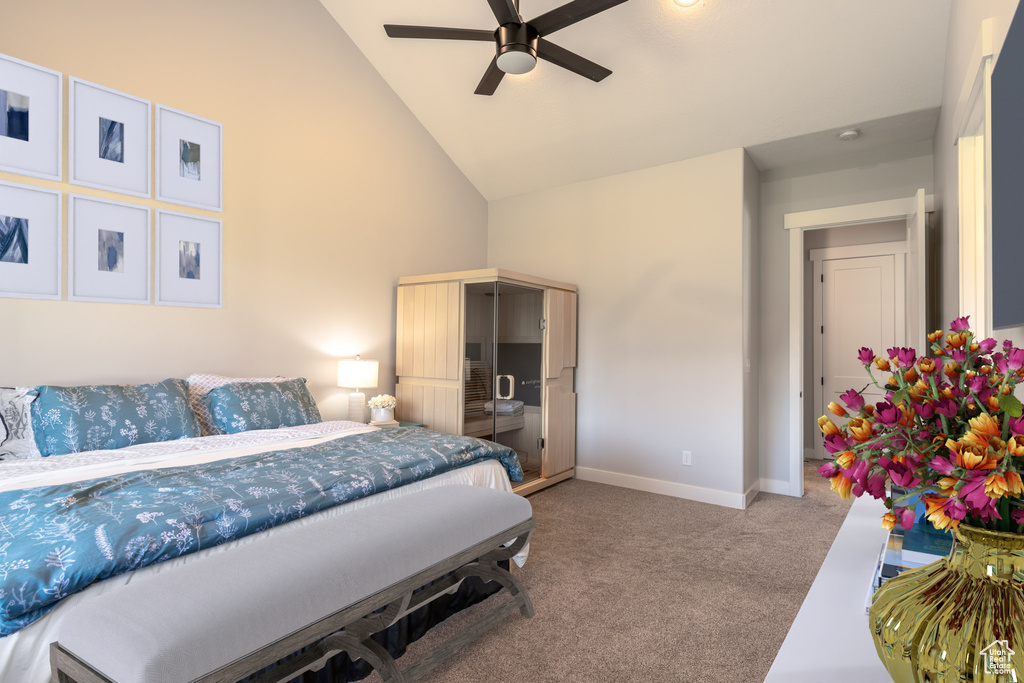 Bedroom featuring high vaulted ceiling, ceiling fan, and carpet floors