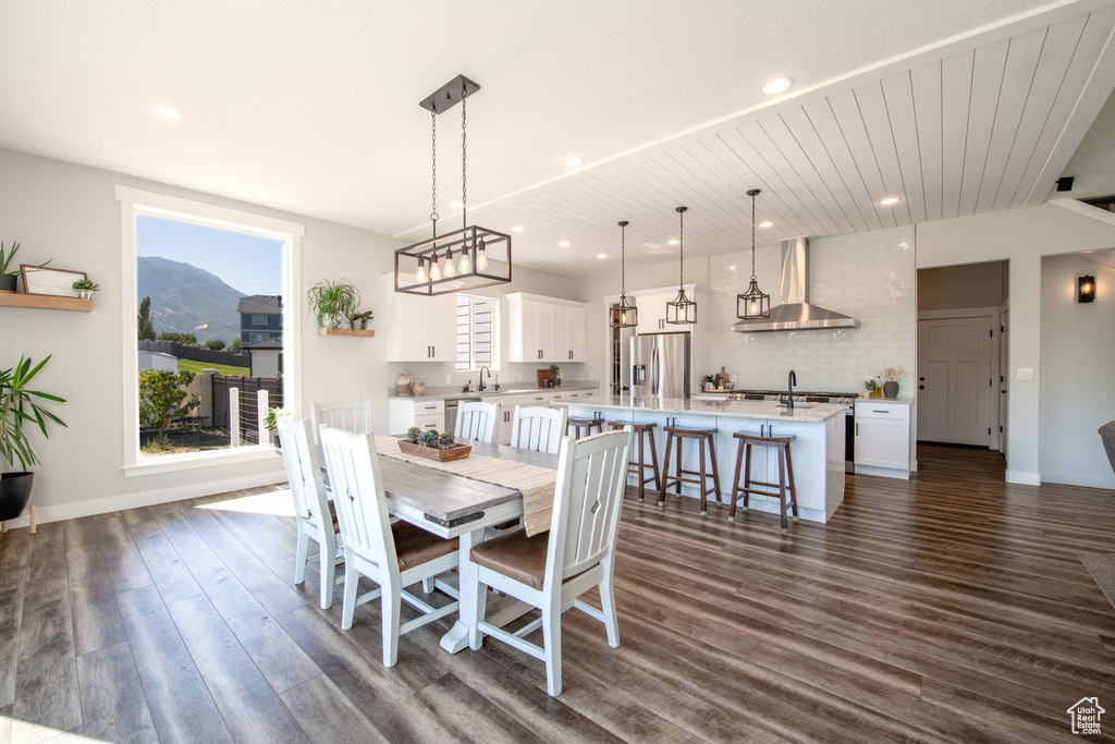 Dining space featuring a mountain view, dark hardwood / wood-style floors, and sink