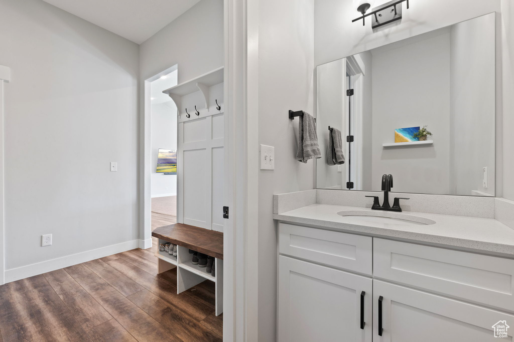 Bathroom featuring vanity and hardwood / wood-style floors