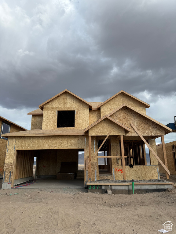 Property under construction with a carport