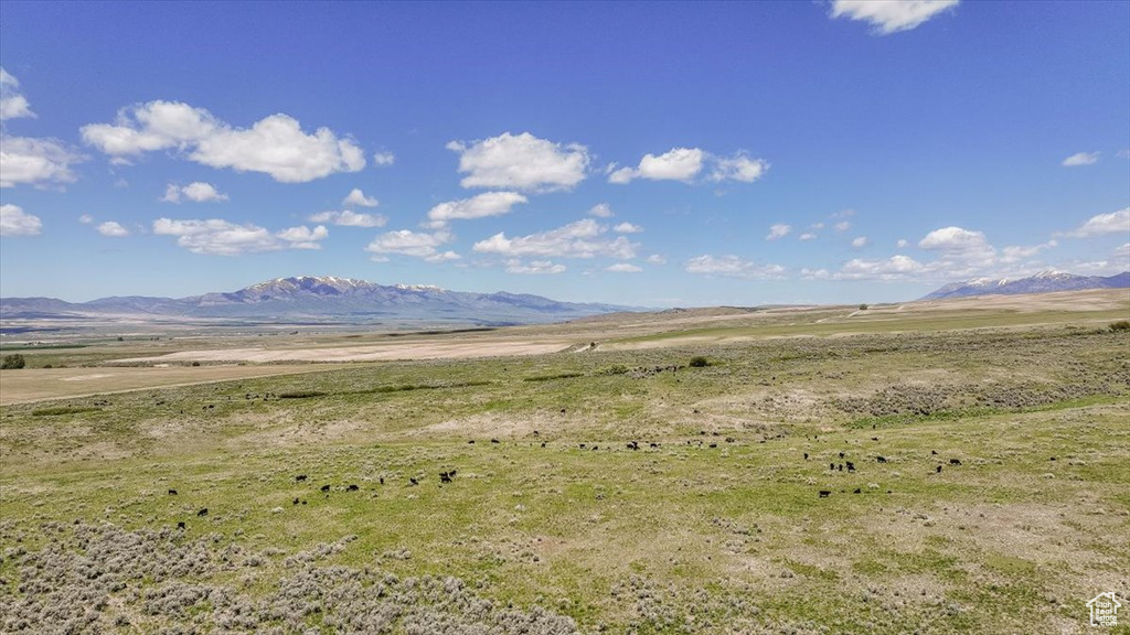 View of mountain backdrop with rural landscape