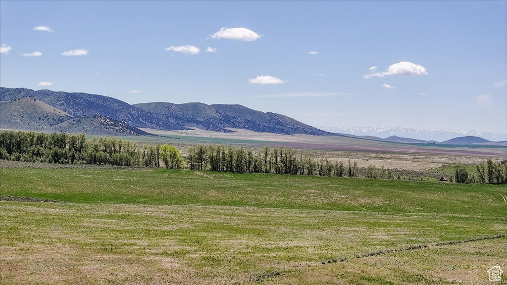View of mountain backdrop featuring rural landscape