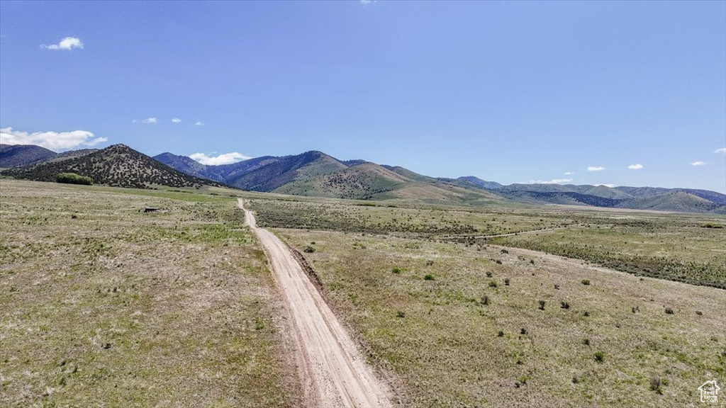 View of mountain background featuring rural landscape