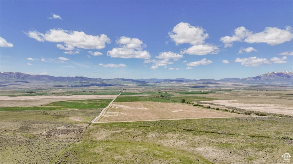 View of mountain backdrop featuring rural landscape
