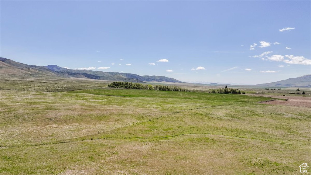 View of mountain background featuring rural landscape