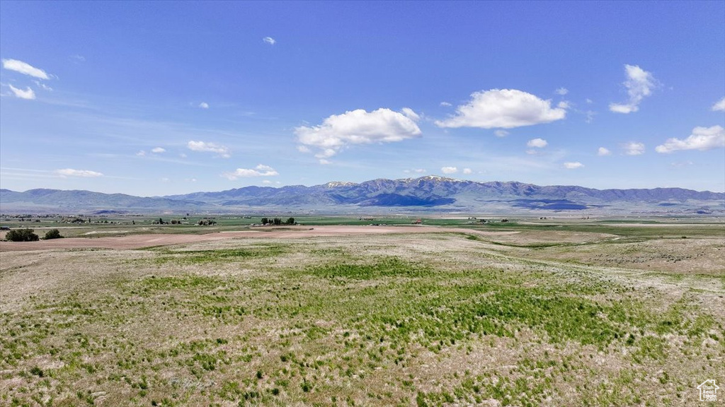 View of mountain backdrop with rural landscape