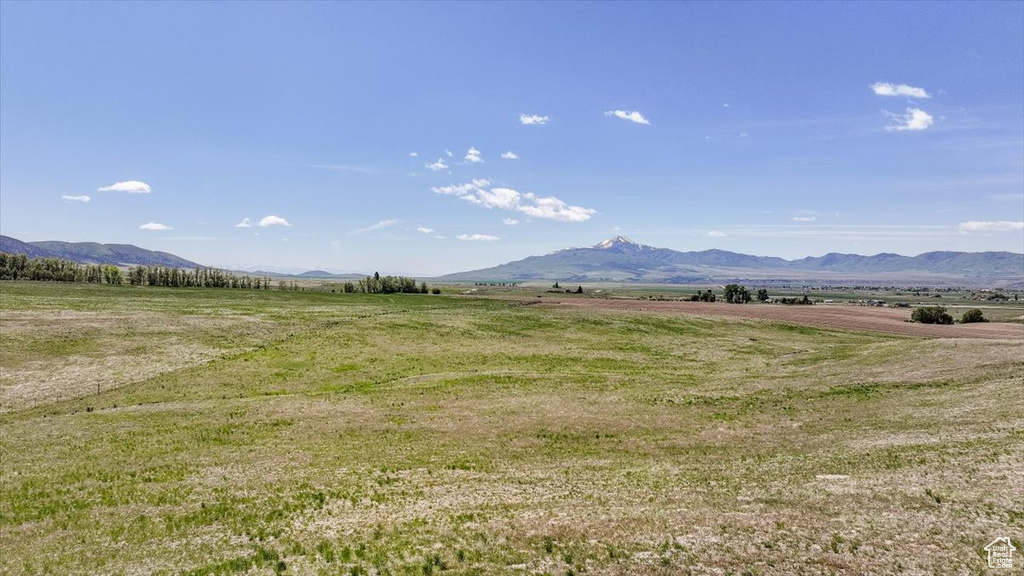 View of mountain backdrop featuring rural landscape
