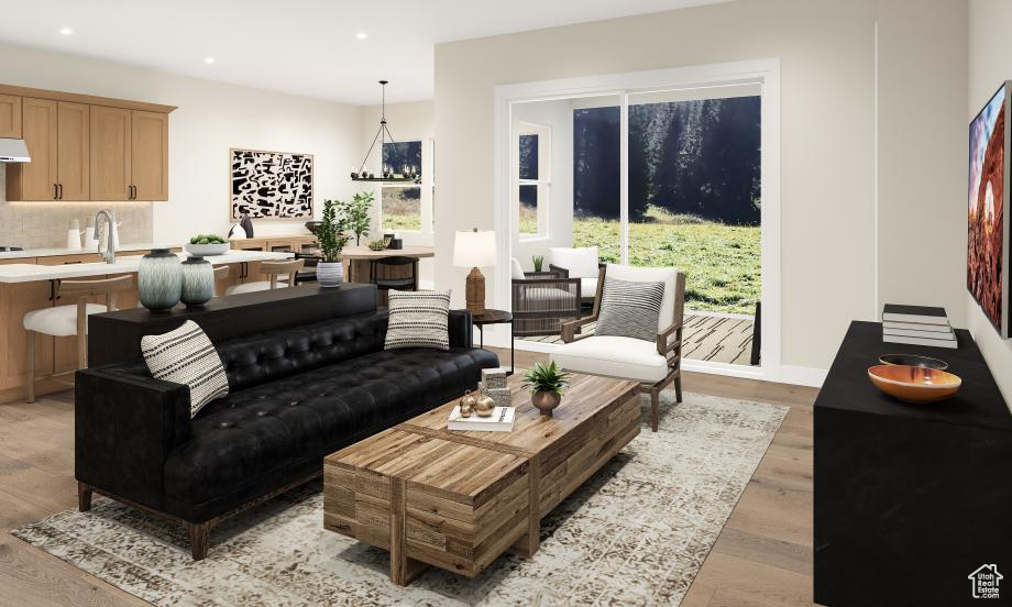 Living room with sink and light hardwood / wood-style floors