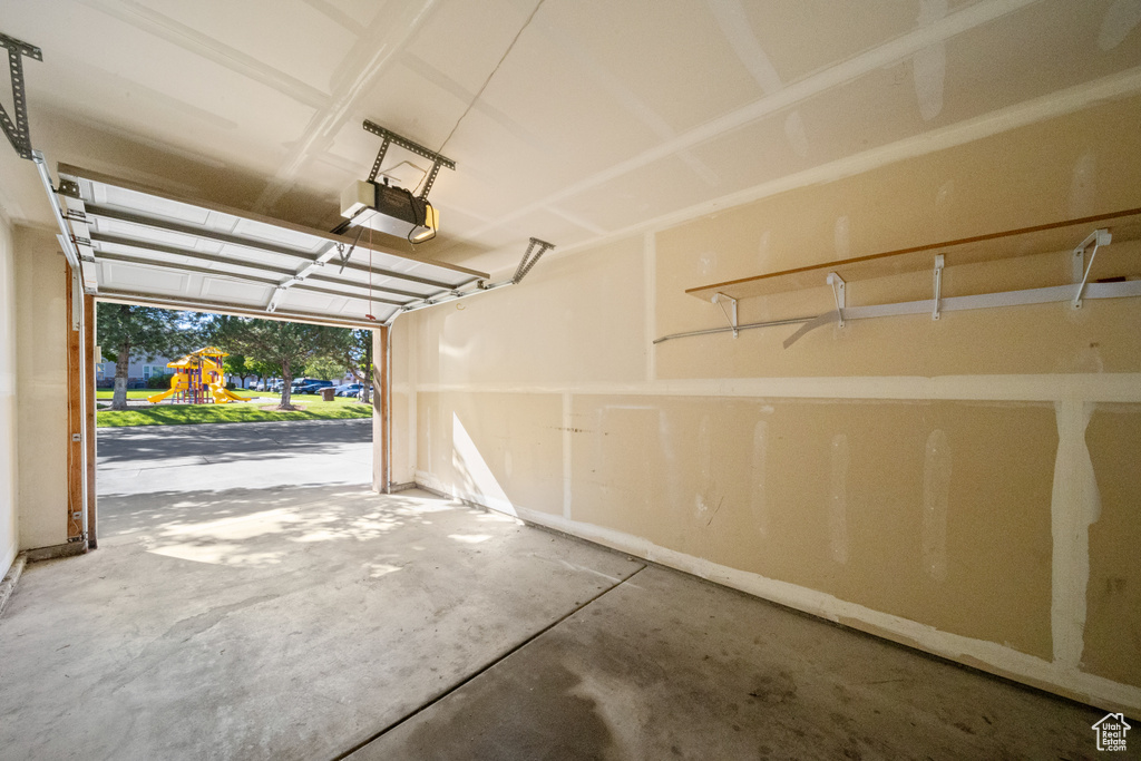 Garage featuring a garage door opener