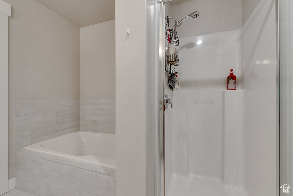 Bathroom with shower with separate bathtub