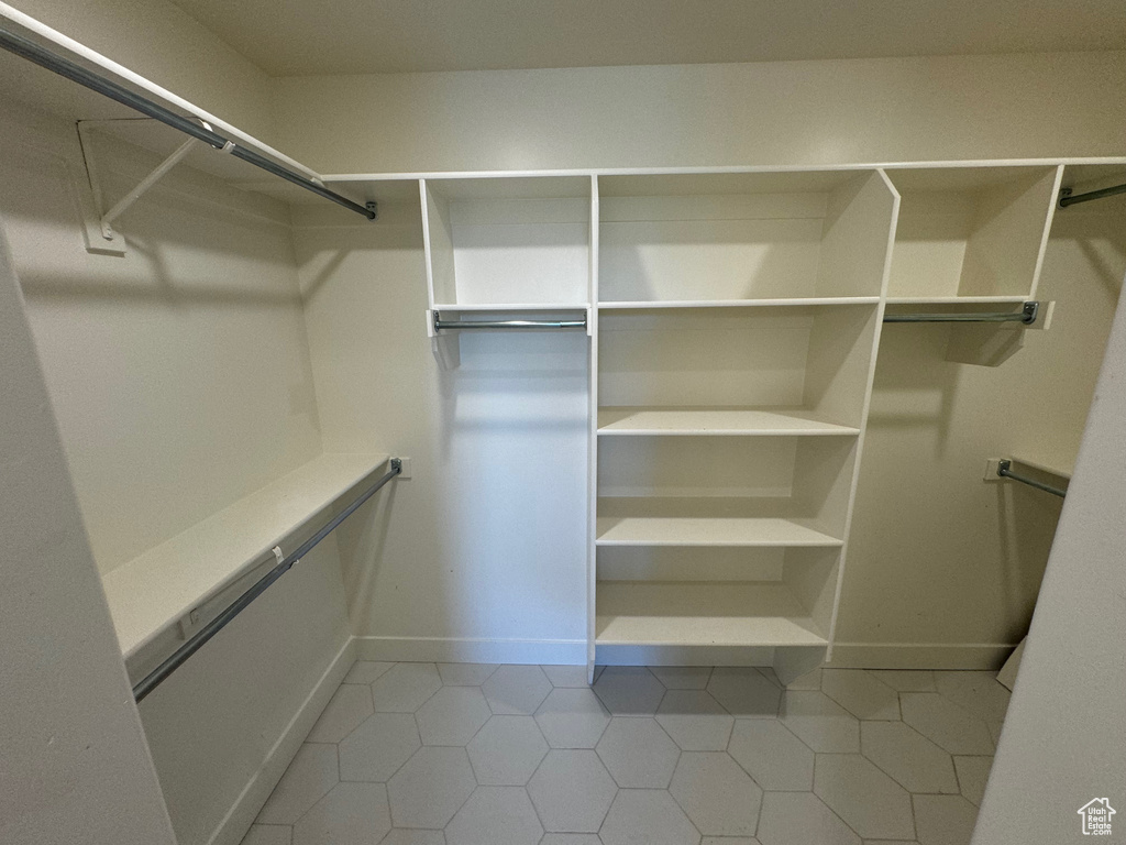 Spacious closet with tile patterned flooring