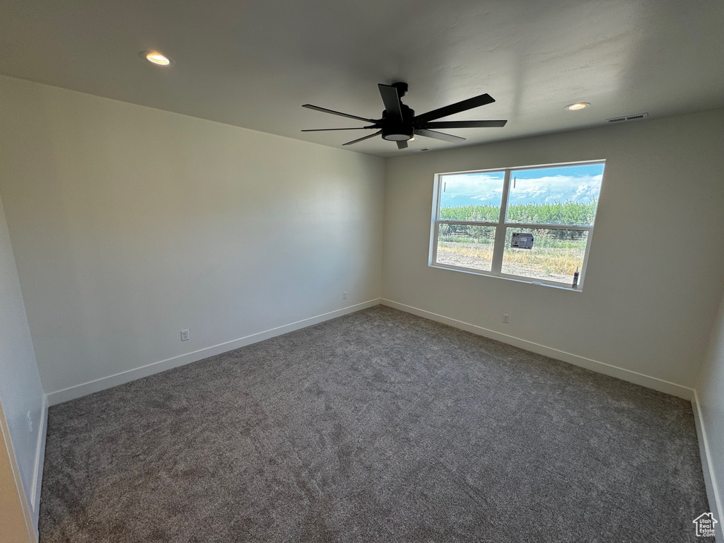 Unfurnished room with carpet flooring and ceiling fan