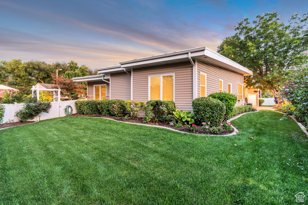 Exterior space featuring a yard