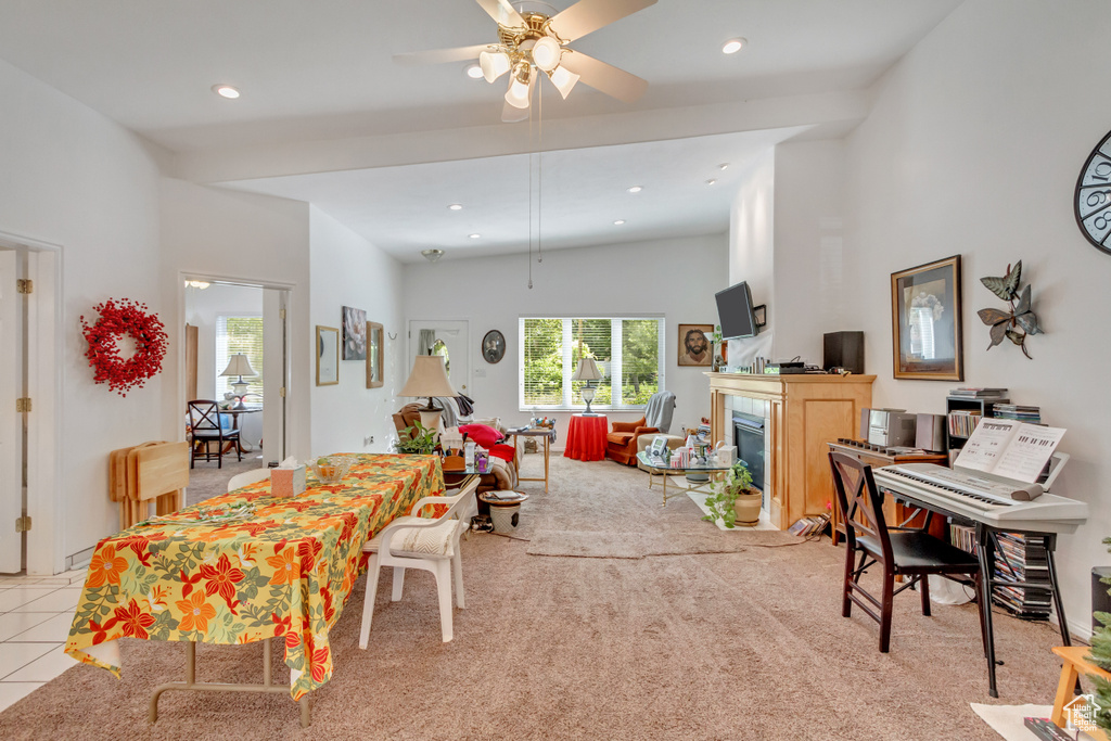 Dining room featuring ceiling fan and light carpet