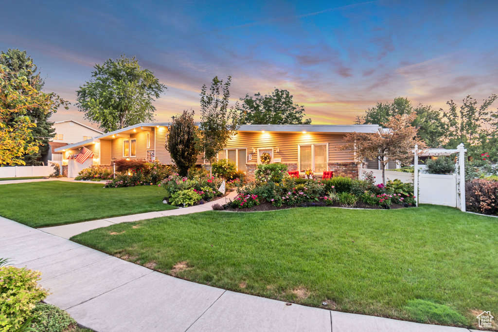 View of front of home with a lawn