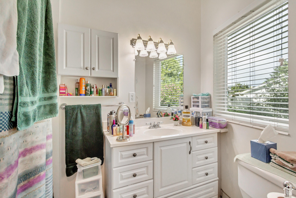 Bathroom with toilet and vanity