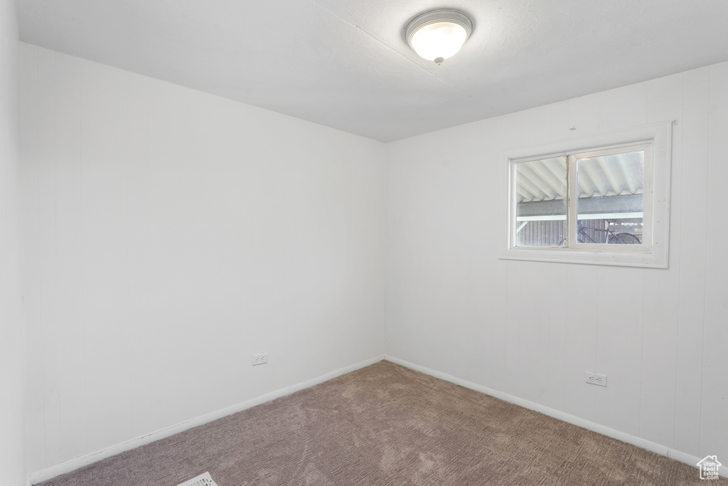 View of carpeted spare room