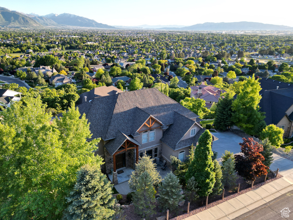 Birds eye view of property with a mountain view