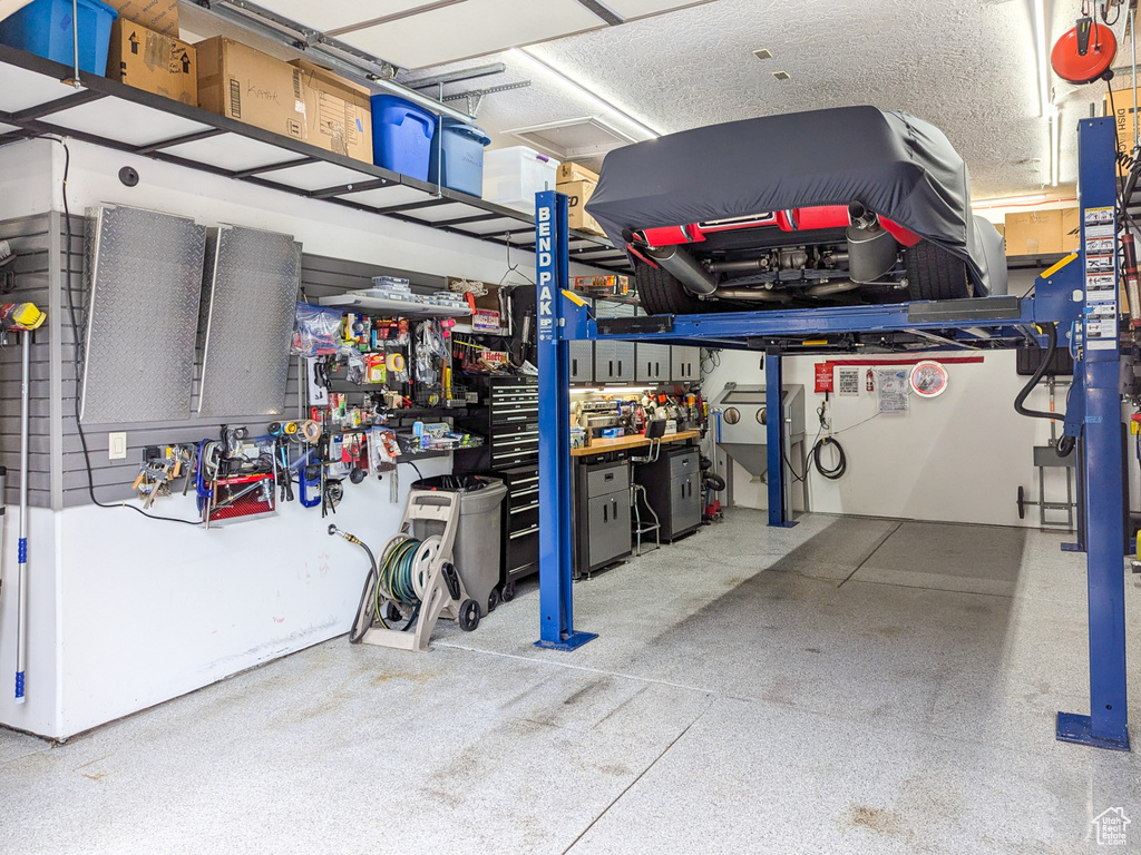 Garage featuring a workshop area