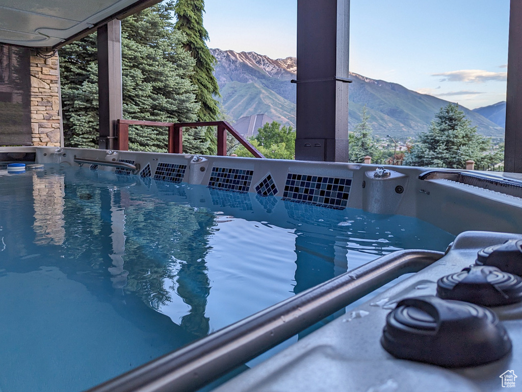 View of pool with a mountain view