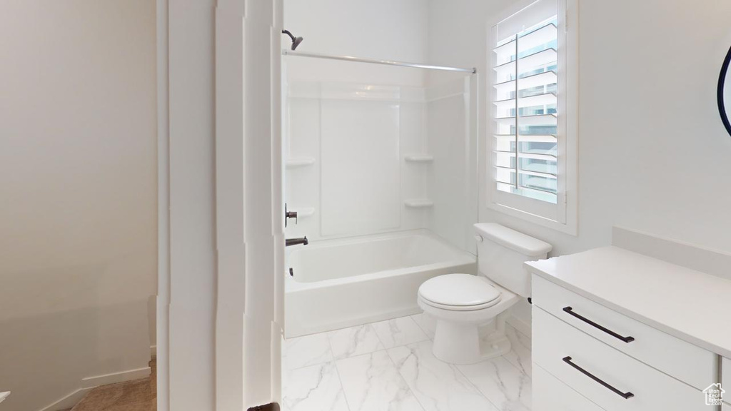 Full bathroom with vanity, a healthy amount of sunlight, and tile patterned floors