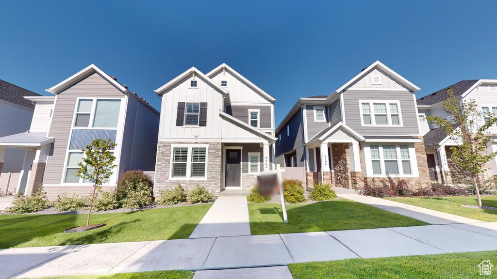 View of front of property with a front lawn