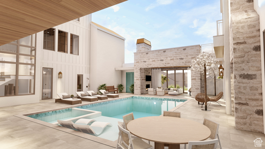 View of pool featuring a patio and an outdoor living space