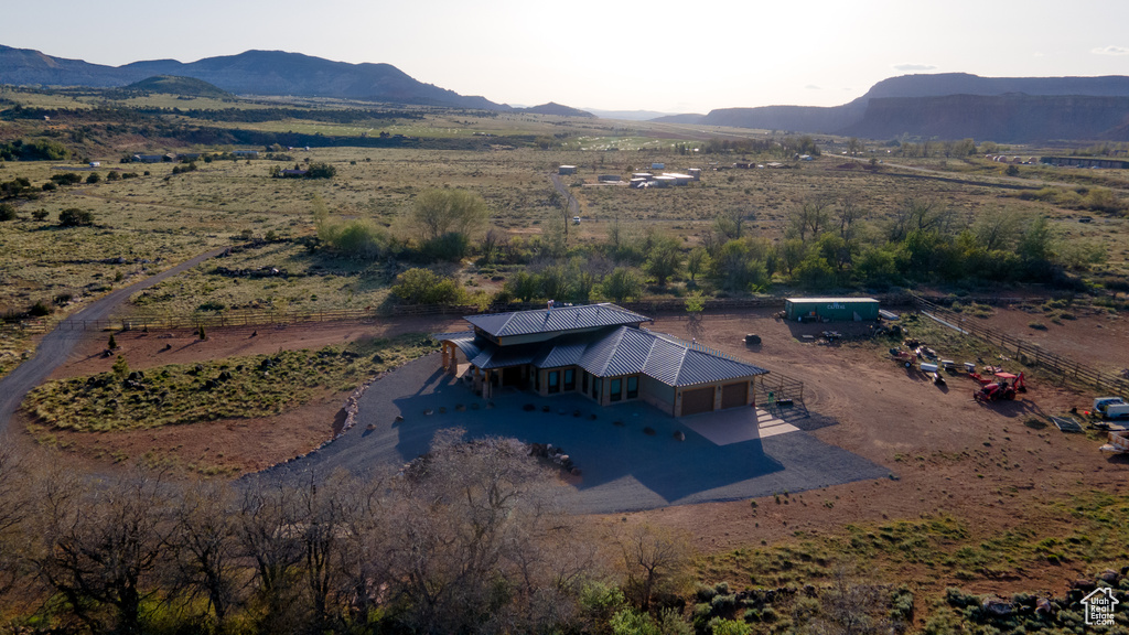 Overview of rural landscape featuring a mountain backdrop