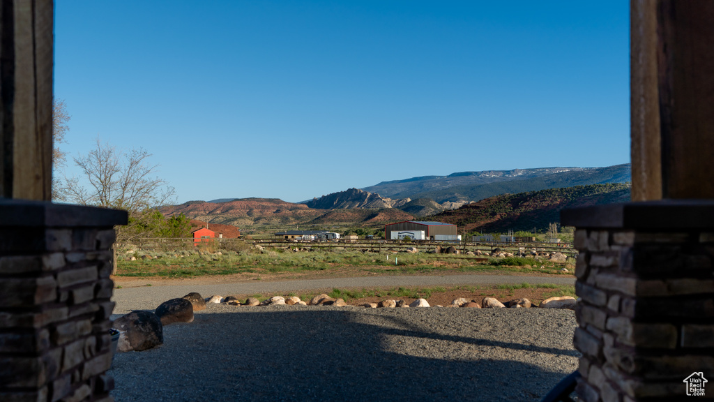 View of mountain backdrop featuring rural landscape