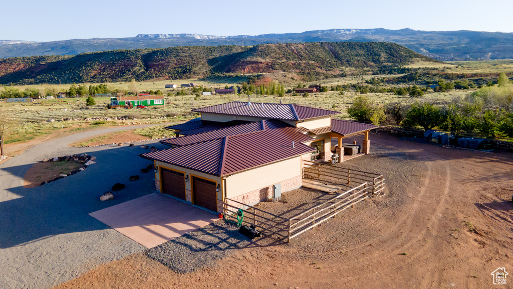 View of subject property with mountains