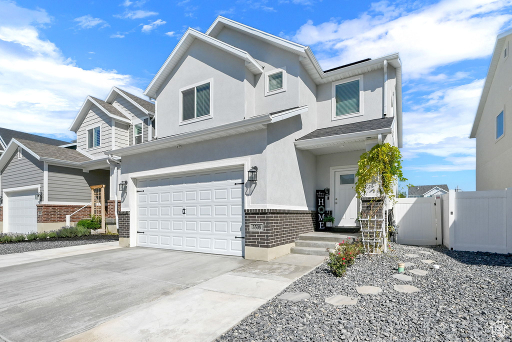 View of property featuring a garage