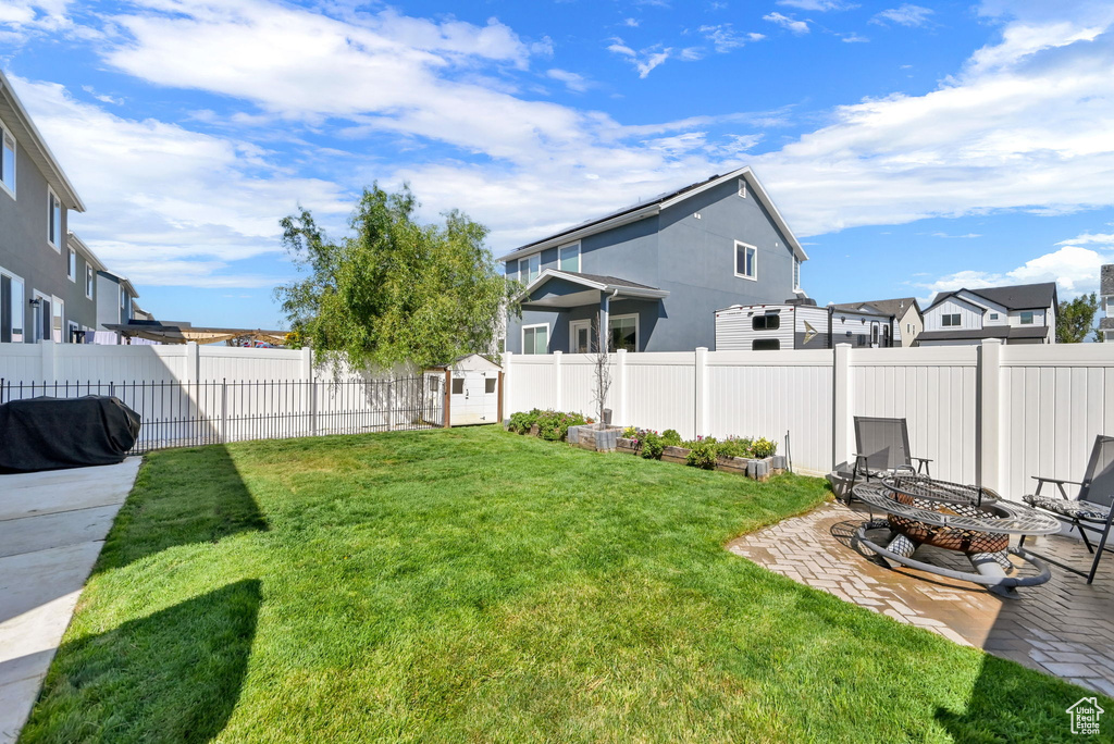 View of yard with a fire pit