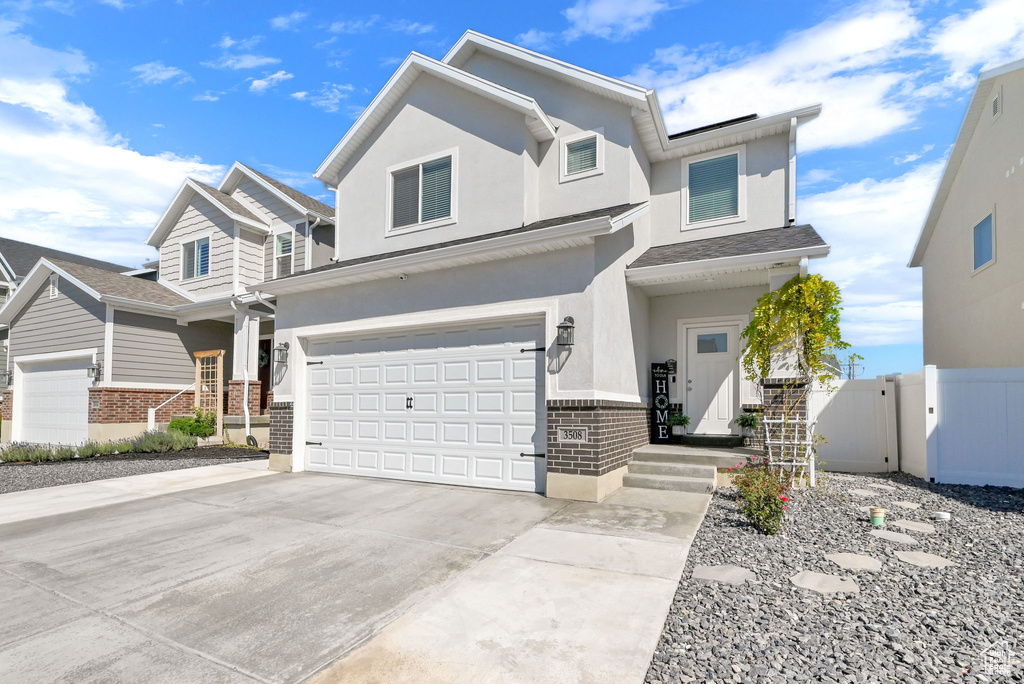 View of front facade featuring a garage