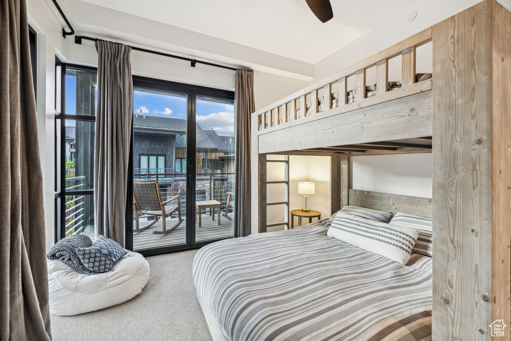 Bedroom with carpet, ceiling fan, and access to exterior