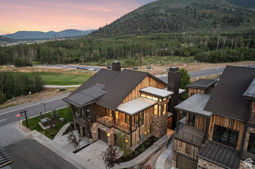 Aerial view at dusk featuring a mountain view