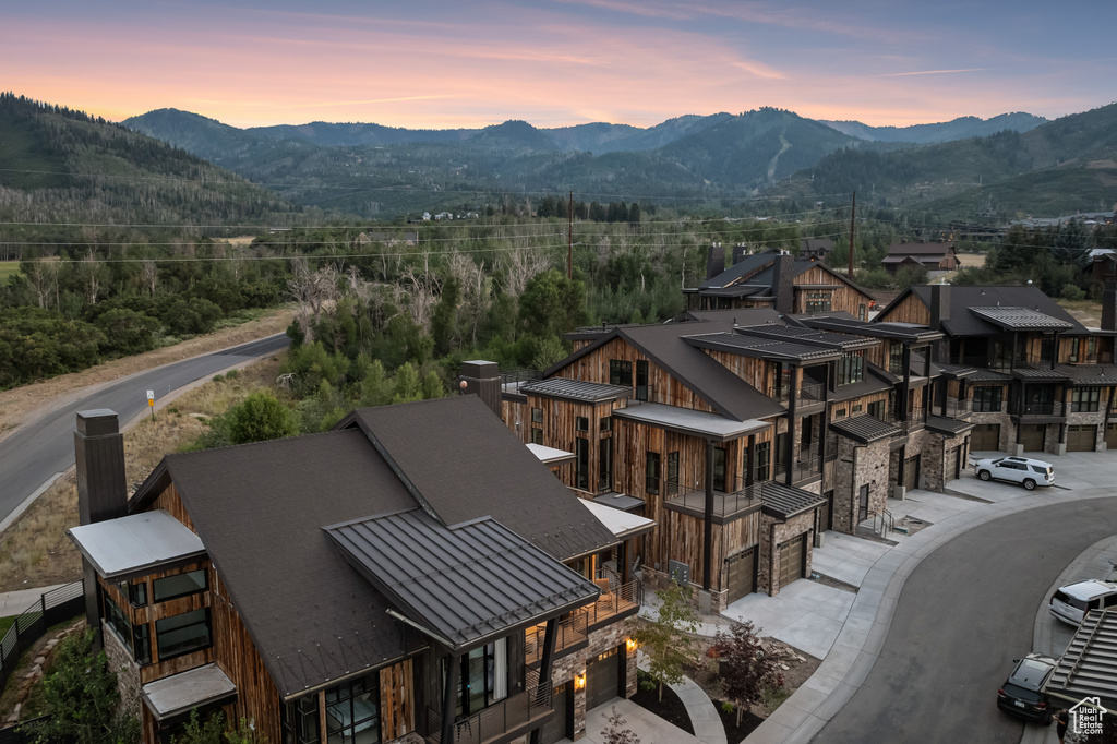 Aerial view at dusk featuring a mountain view