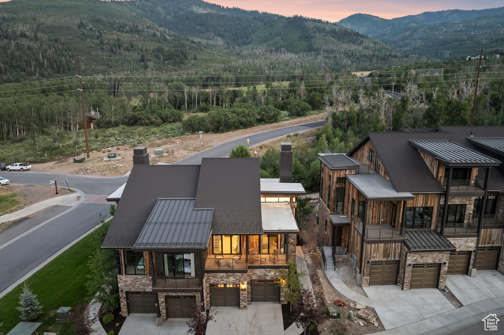 Aerial view at dusk featuring a mountain view