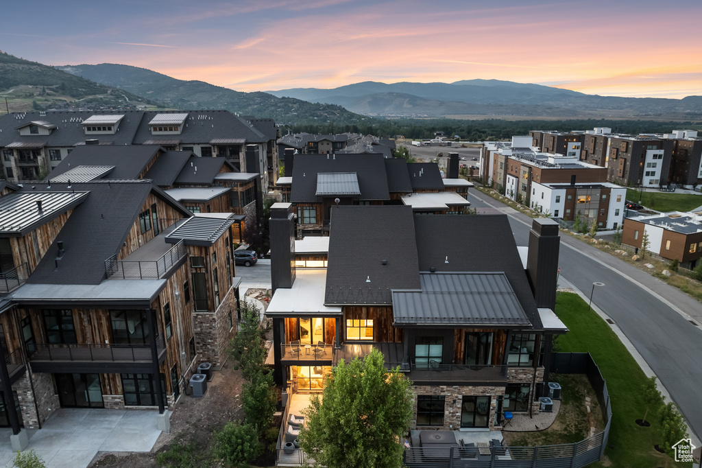 Aerial view at dusk featuring a mountain view