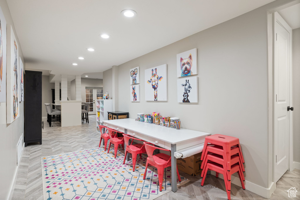 Dining area with light parquet floors