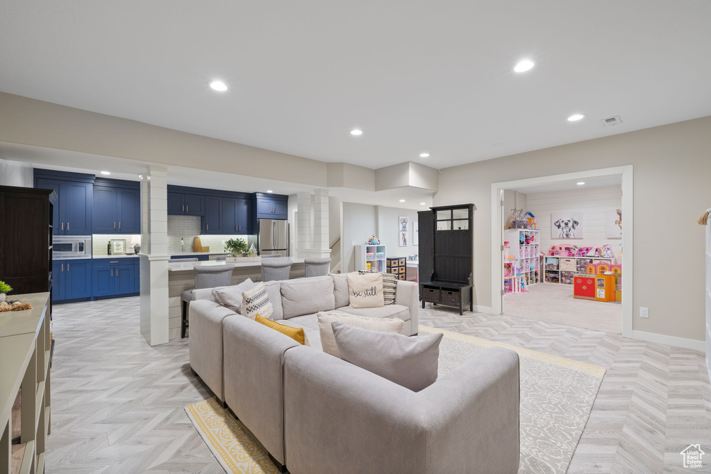 Living room with light parquet floors