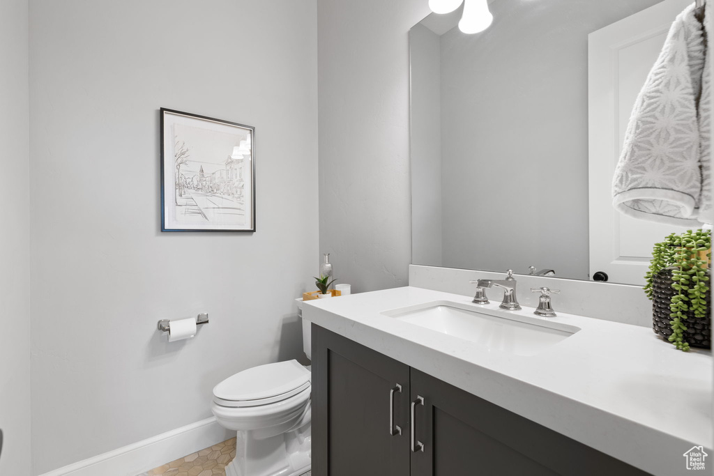 Bathroom featuring vanity and toilet