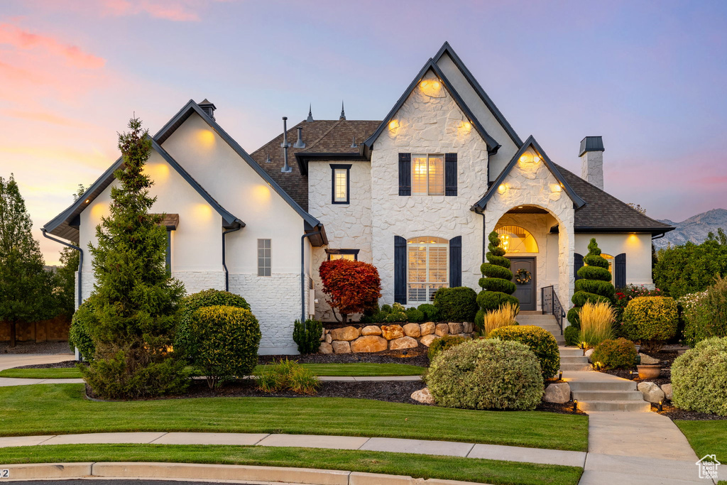 View of front of property with a lawn