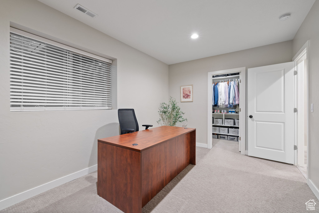 Office space featuring light carpet