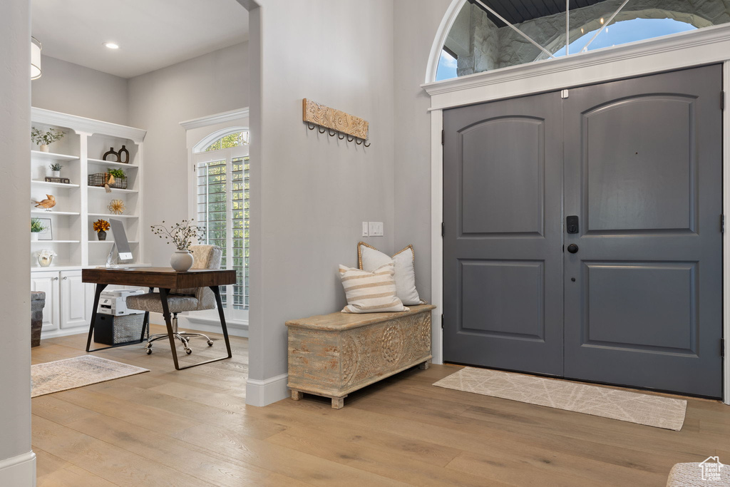 Entryway with light hardwood / wood-style flooring