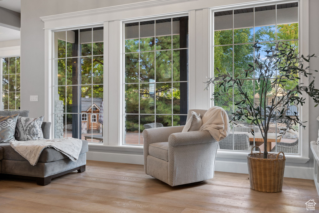 Sitting room with light hardwood / wood-style flooring