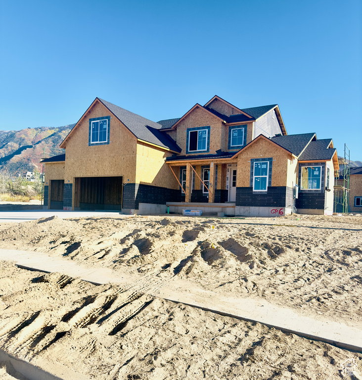 Unfinished property featuring a mountain view