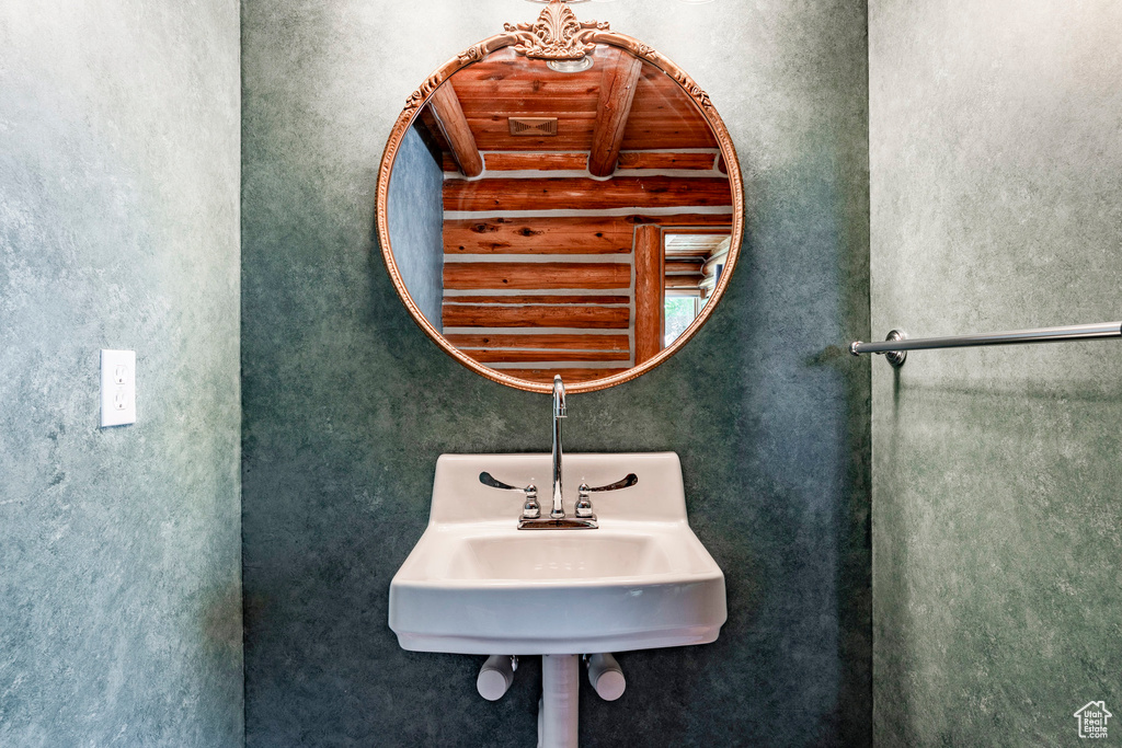 Bathroom with wood ceiling and sink