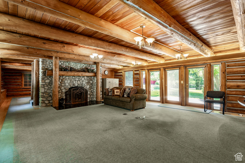 Unfurnished living room with wood ceiling, beamed ceiling, carpet floors, and rustic walls